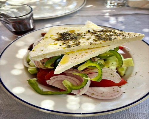 A colorful Mediterranean salad with olive oil dressing